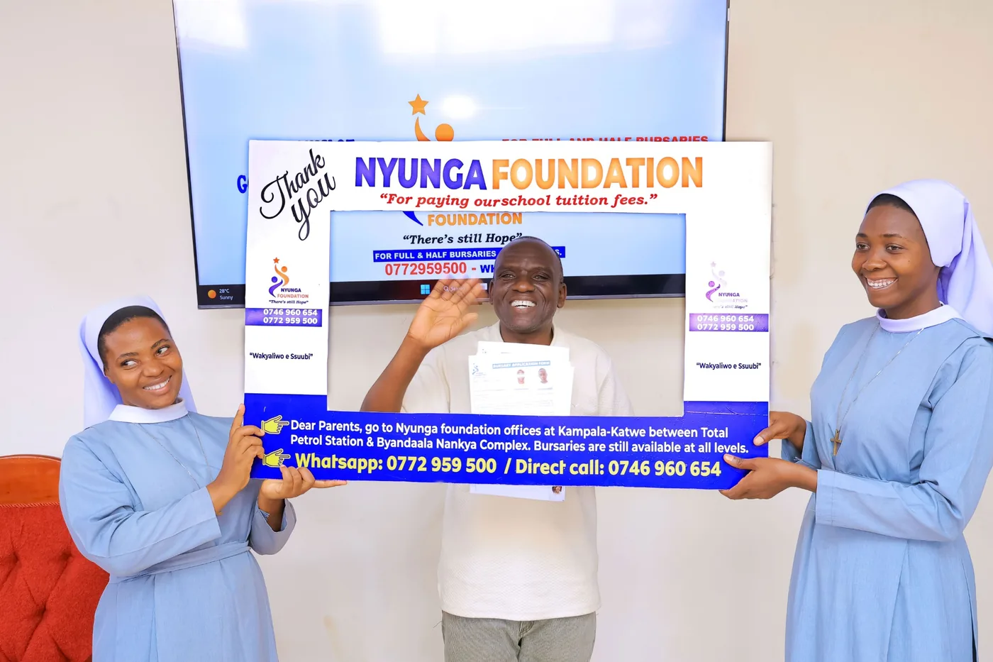 A father celebrates support for his child’s education