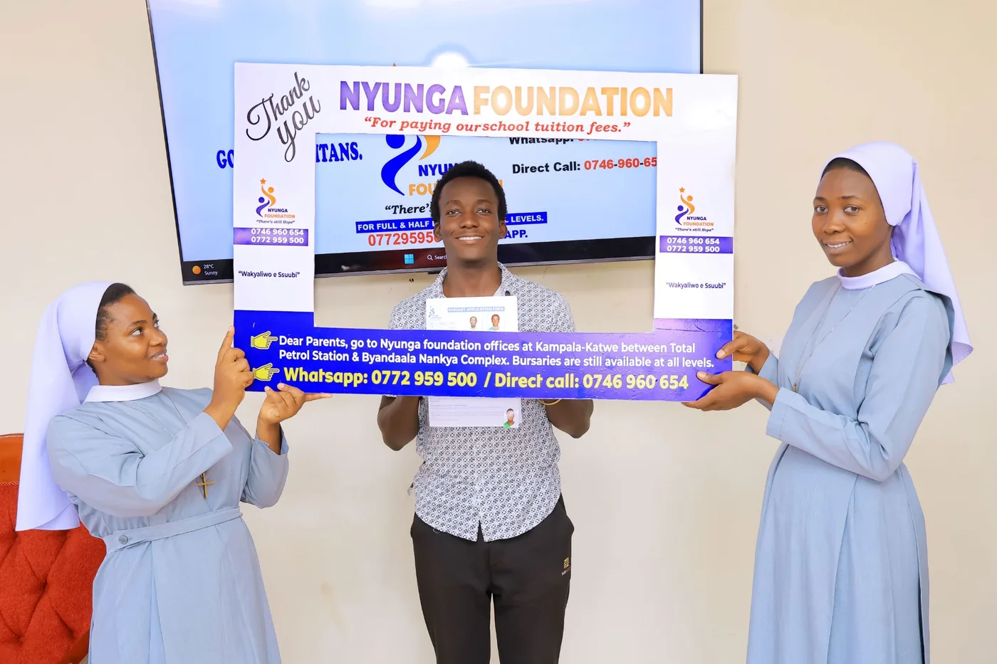 A father receives bursary support for his children