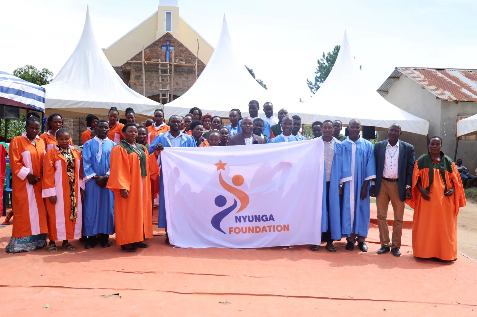 Community and faith representatives with the Nyunga Foundation banner