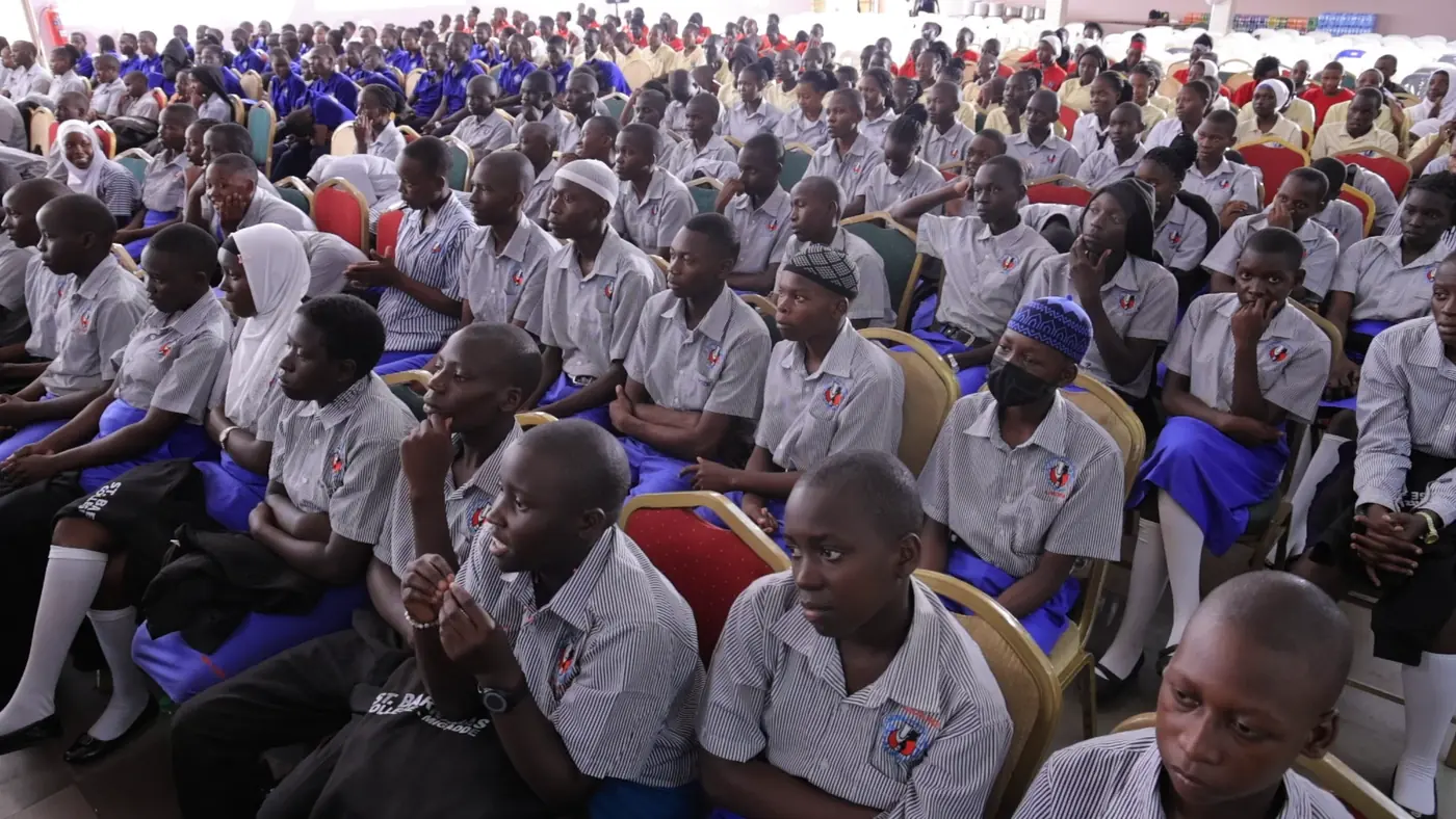 Students participating in a school outreach gathering
